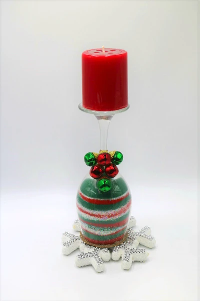 Create a colored sand Christmas candle holder with colored sand and a wine glass! Such a fun Christmas craft for any age! #ChristmasCraft #ChristmasDecor